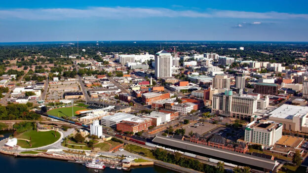 Aerial view of Montgomery, Alabama, showcasing the city's skyline and landscape, representing the progress in tax form processing advancements.
